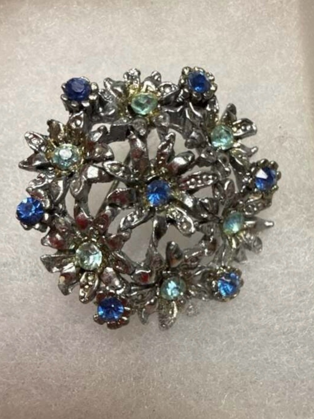Vintage Floral  Brooch with Blue and Light Blue Rhinestones in Silver setting